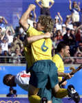 James Elmer is hugged by a teammate after scoring